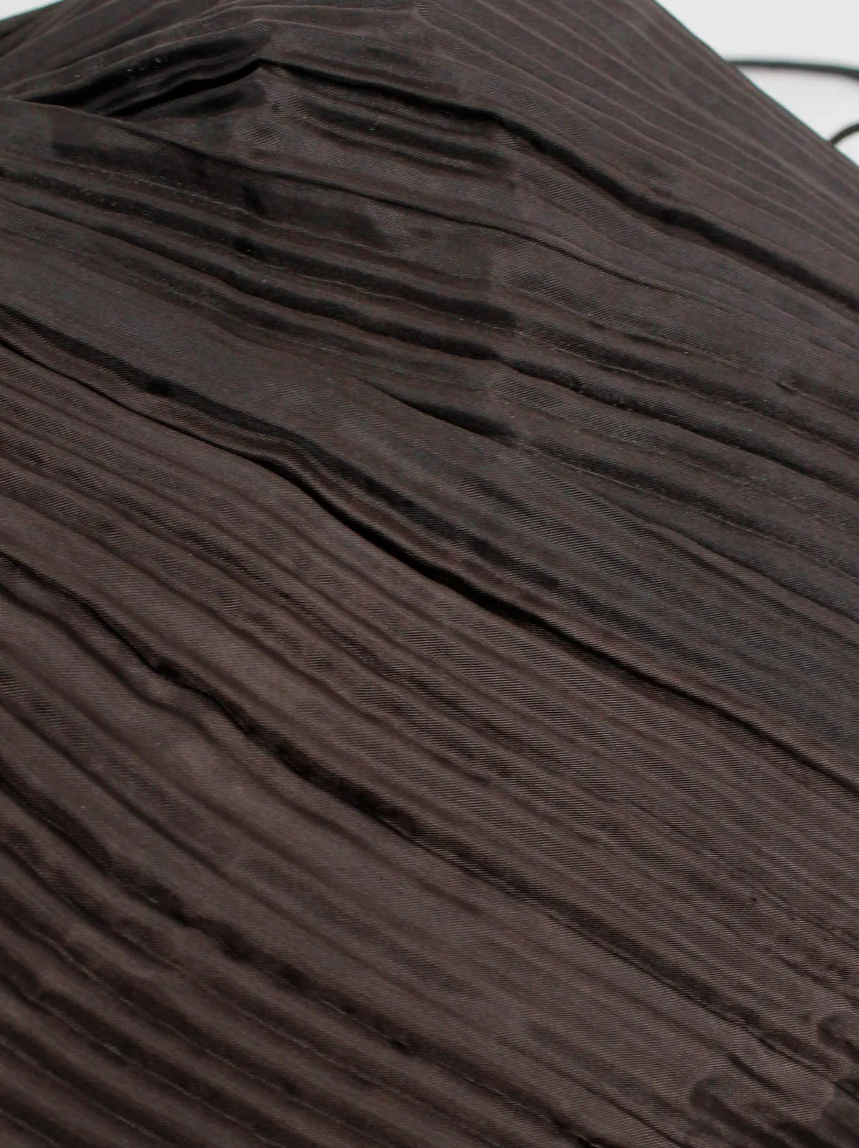 Issey Miyake dark brown drawstring backpack with fine pressed pleats
